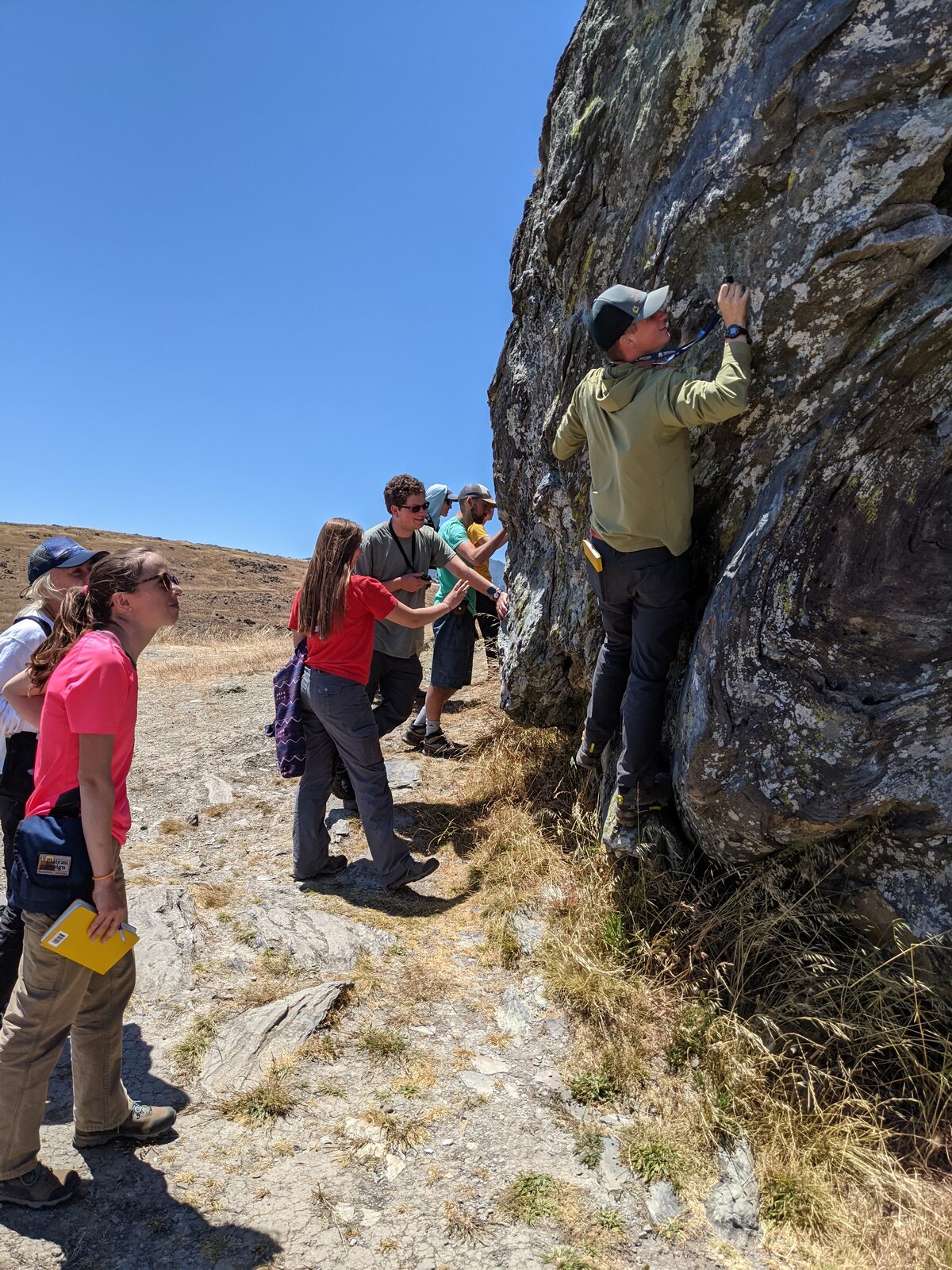 MSU SUR students examining a large block of blueschist