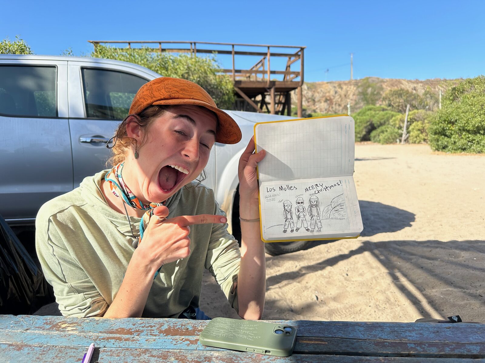 Tiana showing off her Christmas doodle at field camp